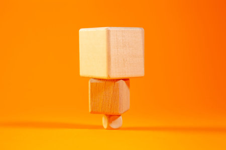 Wooden toy blocks on an orange background. The concept of children's creativity.