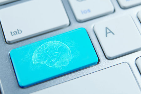 Computer keyboard with brain icon - business and education concept. Selective focus