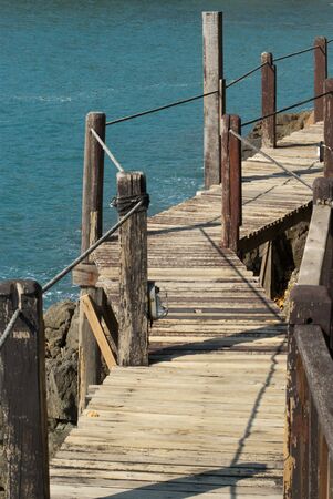Wooden bridge at Cliff and Seaの写真素材