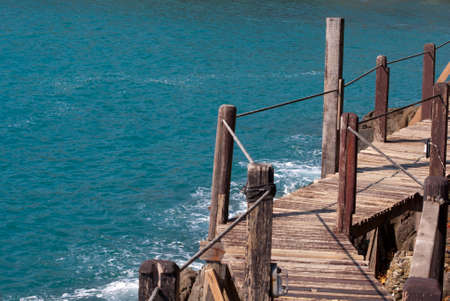 Wooden bridge at Cliff and Seaの写真素材