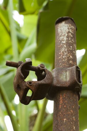 Old scaffold and Rusty pipe clampの写真素材