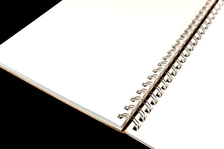 Blank page white paper of Note Book on Black backgroundの写真素材