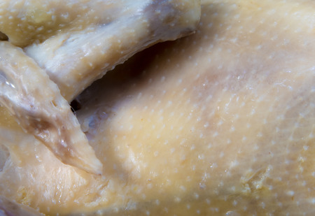Chicken cooked in boiling water in a saucepanの写真素材