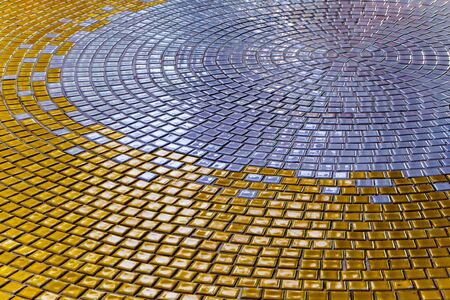 Shiny Gold and Silver color tiles on the floor of hallの写真素材