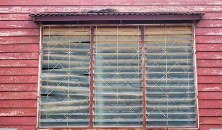 Outside of surface texture wooden wall and old windowの写真素材