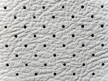 Texture and small eyelet on surface of imitation leatherの写真素材