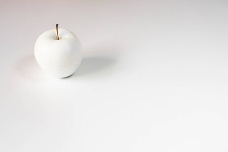 White apple on white backgroundの写真素材