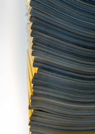 Stack of yellow color monthly magazineの写真素材