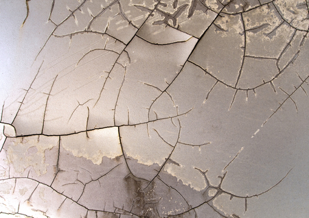 Surface of the old car paint cracked and disintegrated