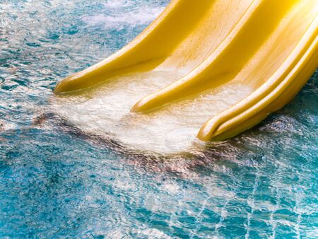 Yellow water slide in the water park