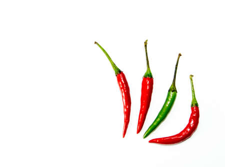 Fresh red and green chili isolated on white backgroundの写真素材