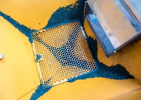 Recycle plastic beads flow to steel hopperの写真素材