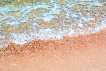 Bubble and clear water of sea and wave on the beach