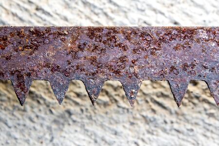 The sharpness of saw blade is old and rusty On the concrete floorの写真素材