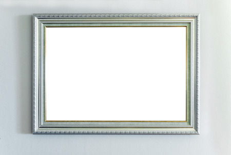 The blank ornate picture frame on the wallの写真素材