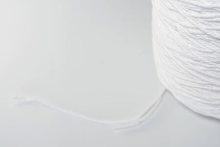 Roll of white rope isolated on white backgroundの写真素材