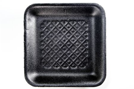 Black foam tray isolated in white backgroundの写真素材