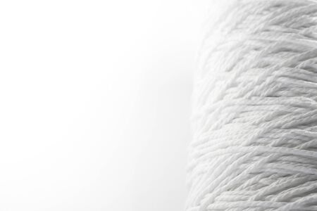 Roll of white rope isolated on white background