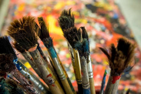 Many old paintbrush on art work tableの写真素材
