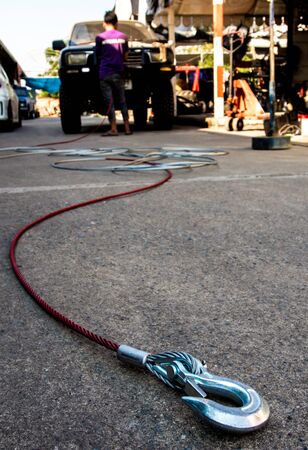 New cable and hook installing to the winch of carの写真素材