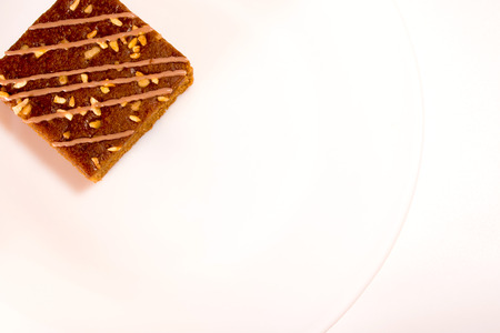 Small pieces of caramel coffee cake isolated on white background