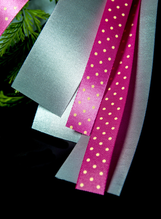 Ribbon bow, silver and pink dot pattern at the beautiful flower bouquetの写真素材