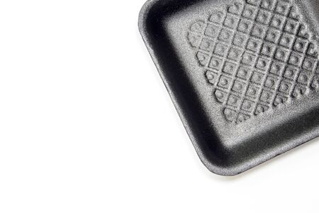 Black foam tray isolated in white backgroundの写真素材