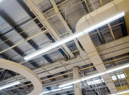 Ceiling mounted Lamps pipes and air ducts and communication system in the hall
