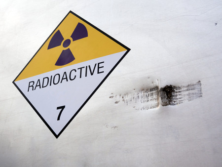Radiation warning sign on the Hazardous materials transport label Class 7 at the aluminum container of transport truckの写真素材