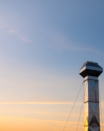 Sunset sky in twilight background of factory chimneyの写真素材