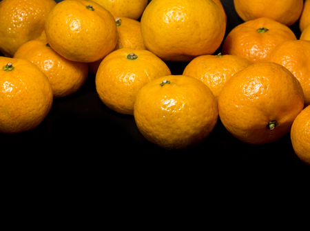 Close-up on glossy surface of freshness orange fruitsの写真素材