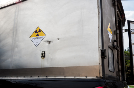 Radiation warning sign on the Hazardous materials transport label Class 7 at the wooden box package...