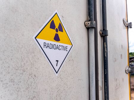 Radiation warning sign on the Hazardous materials transport label Class 7 at the aluminum container of transport truckの写真素材