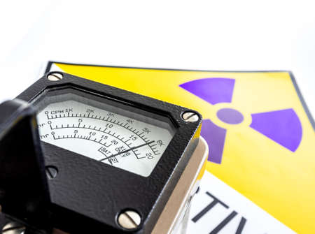 Hand-held radiation survey instrument detecting at the radioactive material symbol on label
