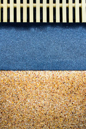 The different surface texture on joint of the exposed aggregate finish flooring and the marble...