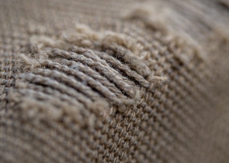 close-up of the tear of the old cloth bagの写真素材