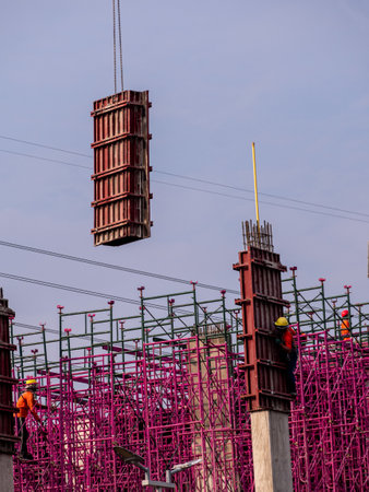 The pink scaffolding on the building under construction