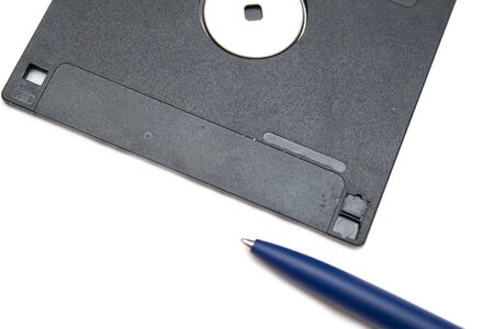 blue pen and disket on the white isolated backgroundの写真素材