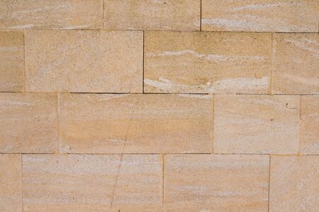 wall surface from old yellow bricksの写真素材