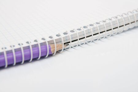 opened notebook with pencil
