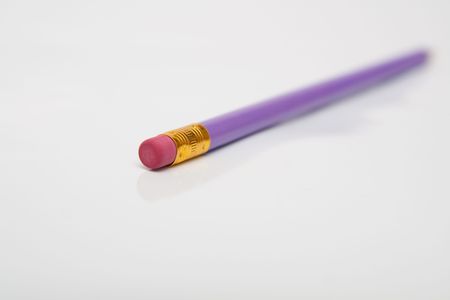 violet pencil isolated on whiteの写真素材