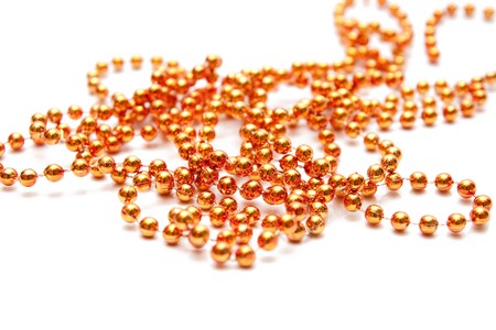 golden beads isolated on whiteの写真素材