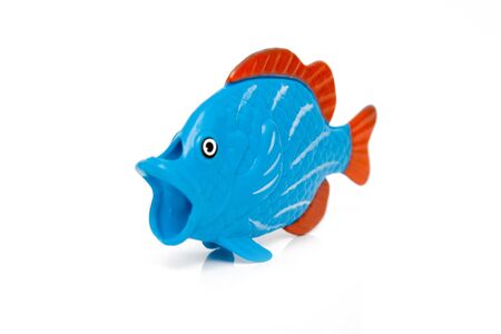 fish toy isolated on whiteの写真素材