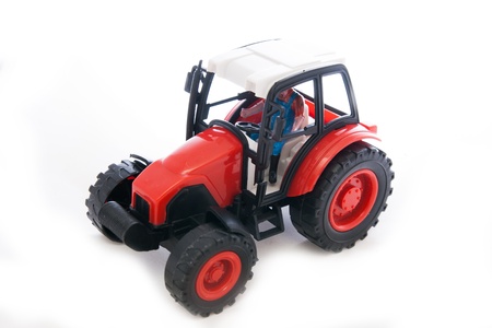 Tractor red toy on whiteの写真素材