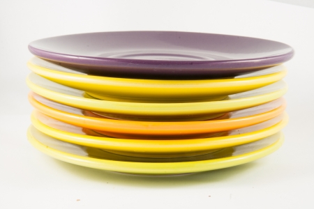 Colorful plates stacked one above the otherの写真素材