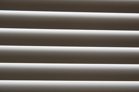 White shutters over a shop doorsの写真素材