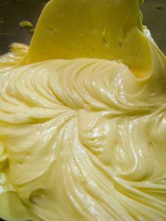 melt butter in the bowl make some incredible texture from food mixer machine.の写真素材
