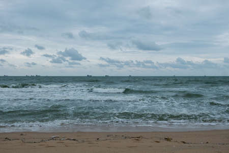 wave on the dirty quiet beach in Thailandの写真素材
