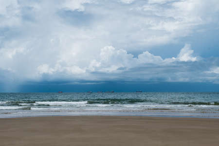 wave on the dirty quiet beach in Thailandの写真素材
