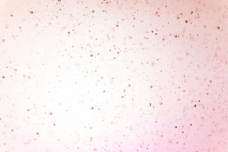 small air bubble free floating in clear liquids with light in backgroundの写真素材